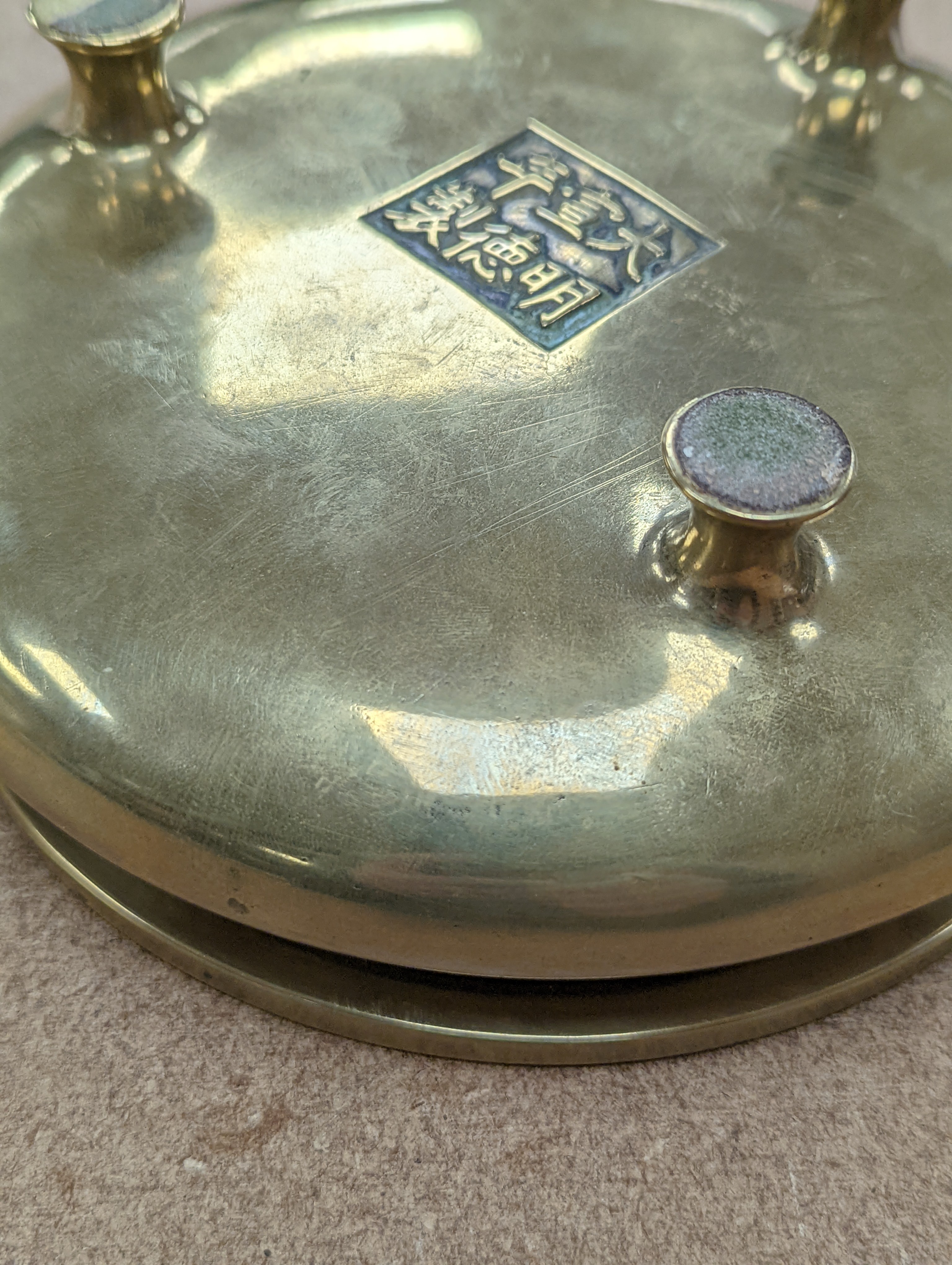 A Chinese bronze censer, ding, Xuande mark, 18th / 19th century, diameter 16.6cm, height 6.7cm